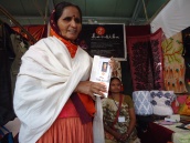 Kaku Ben, an appliqué artisan, from Bhuj, Gujarat. Here she proudly shows her mother’s picture who was a national award winner.