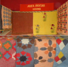 Traditional Kashmiri felted rugs on display at the exhibition.